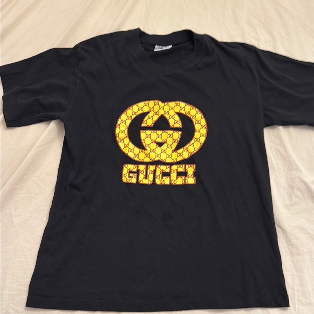 Gucci Black Tee with Vibrant Yellow Emblem
